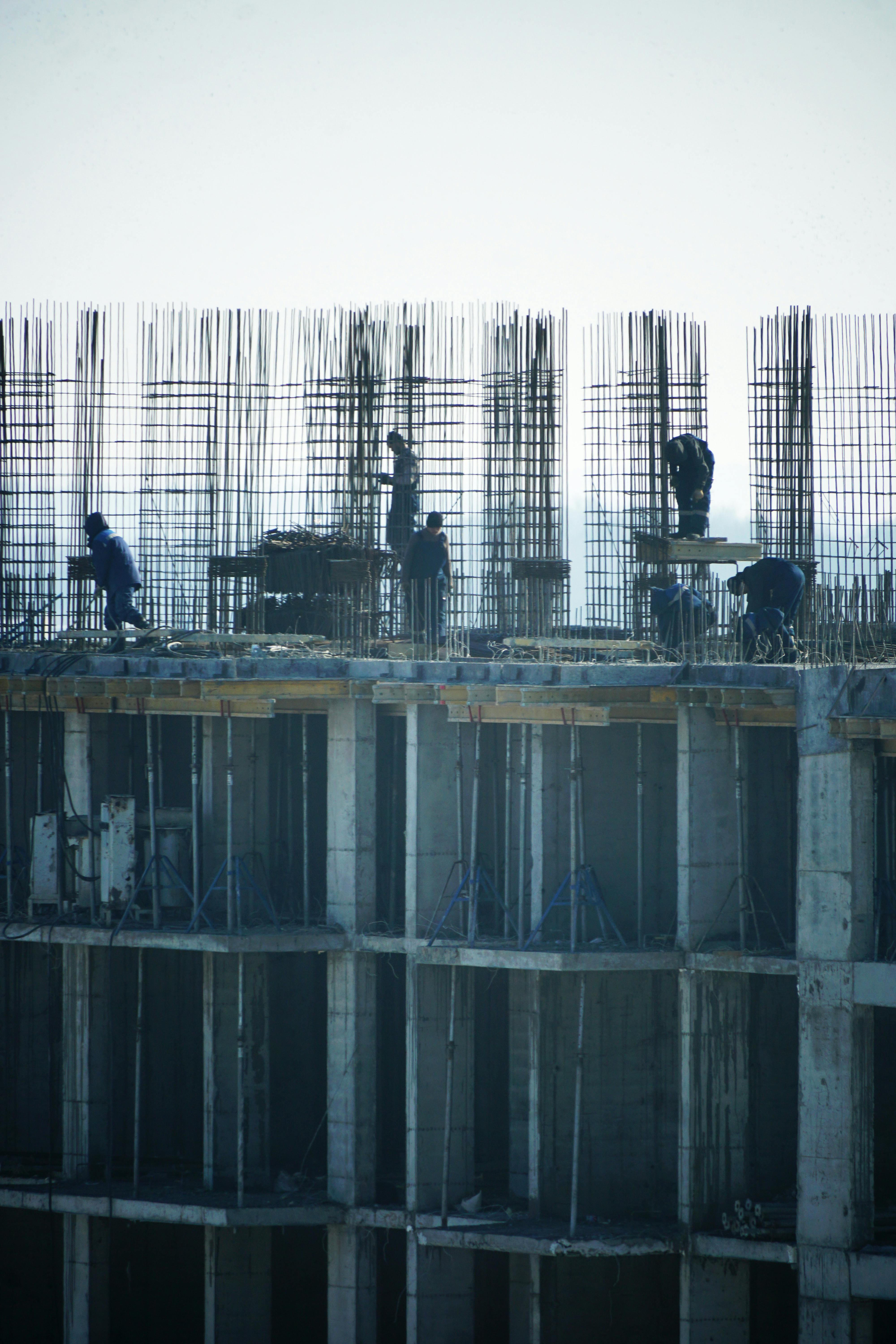 Kalisi Ltd workers on a reinforced concrete frame with steel rebar
